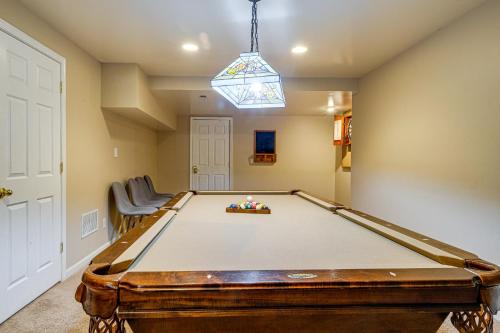 a pool table in a room with a ceiling at Family Retreat with Fenced Yard in Woodbridge! in Woodbridge
