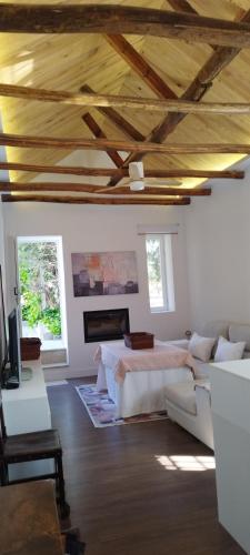 a living room with a bed and a couch at Balcón de Granada Skyline in Las Gabias