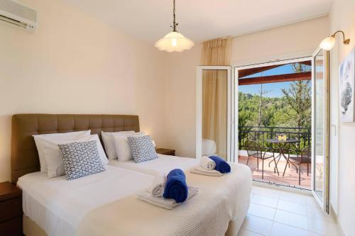 A bed or beds in a room at Villa Apollo Springs by Villa Plus