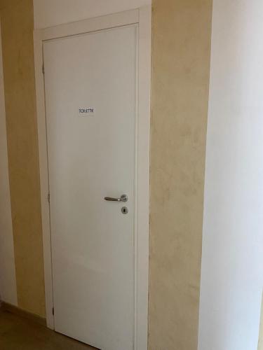 a white door with the word repair written on it at A I R Sorrento House 2 in Sorrento