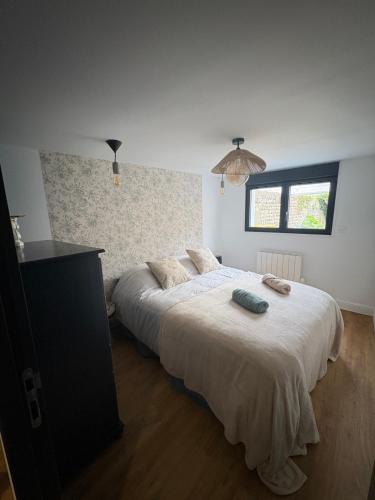 Letto o letti in una camera di L'ATELIER YPORT