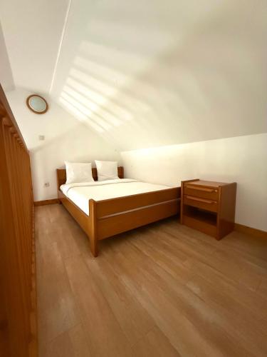 a bedroom with a bed and a table in a room at Ma Campagne in Saint-Rémy