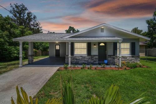 a house with a driveway in a yard at Comfortable Home in Dade City! in Dade City