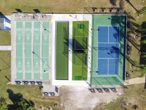 an aerial view of a building with green and blue glass at 2 Bed Cozy Home, Dade City, Pickle Ball and Pool in Dade City