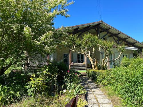 a house with a walkway in front of it at Maison de vacances Bazas in Lignan-de-Bazas