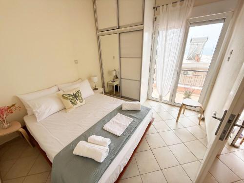 Ένα ή περισσότερα κρεβάτια σε δωμάτιο στο Thassos Sea View Apartment