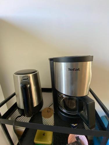 a coffee pot sitting on top of a shelf at Le nid d'Eugénie in Blaudeix