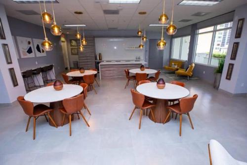 a room with tables and chairs in a building at Exclusive 2BR APT Brickell Free Parking in Miami