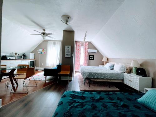 a bedroom with a bed and a desk in a room at Executive Suite Loft - Harvard Allston Campus in Boston
