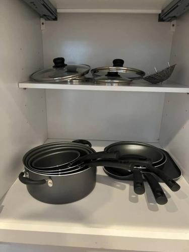 a pot and pans sitting on a stove in a kitchen at Entire Home in Dade City! in Dade City