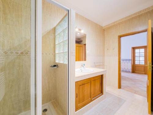 a bathroom with a sink and a shower at Casa Marina V4 by YHA in Tavira