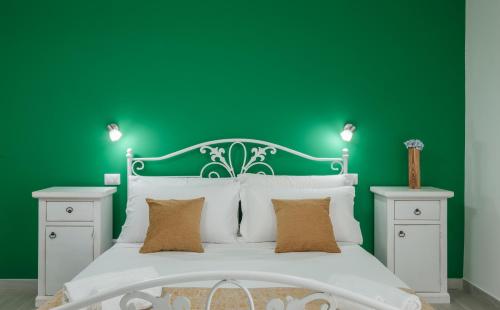 Postel nebo postele na pokoji v ubytování Sa Domu Colorada- Eleganza e comfort nel centro di Villasimius