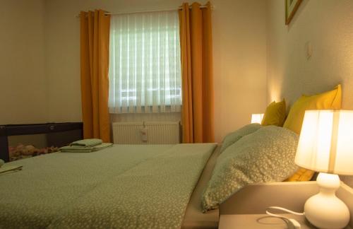Ένα ή περισσότερα κρεβάτια σε δωμάτιο στο Apartman Rita