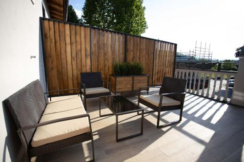 a patio with chairs and a table and a fence at Borgo dei Papi in Anagni