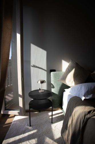 a bedroom with a bed and a table and a chair at Borgo dei Papi in Anagni