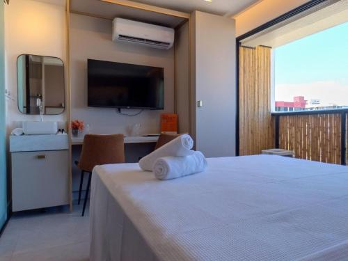 Una cama o camas en una habitación de Restinga by Xtay - Studios com piscina e academia, pé na areia em João Pessoa