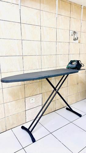 a table with a mouse sitting on top of it at Studio Laluciole Louis in Libreville