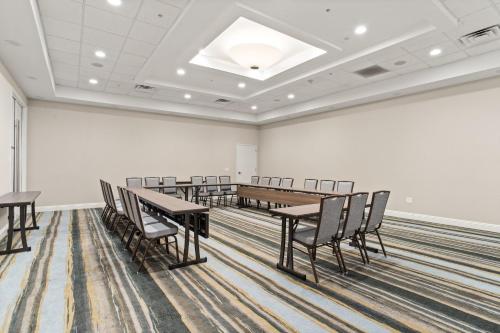 a conference room with a long table and chairs at Holiday Inn Baton Rouge College Drive I-10 by IHG in Baton Rouge
