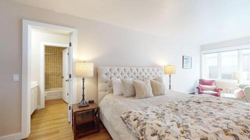 a bedroom with a large bed and a window at Knob Hill Ridge Townhome 1 in Ketchum