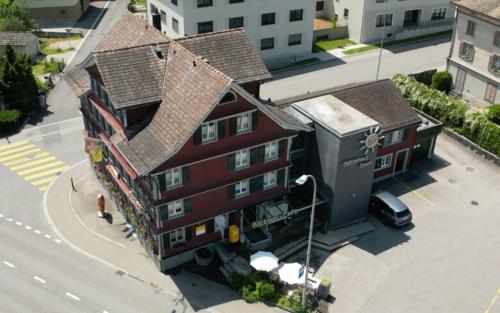 an overhead view of a large building with a roof at Gästehaus Sonne in Bütschwil