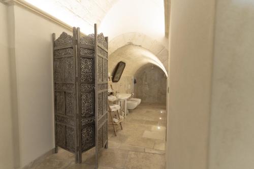 a bathroom with a toilet and a sink at Palazzo Del Duca Hotel & Restaurant in Matera