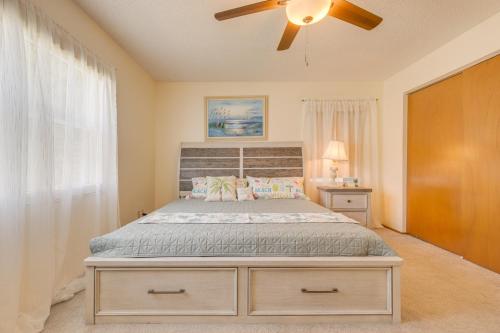 a bedroom with a bed with a ceiling fan at King size bed, private bathroom, flat TV in Clearwater