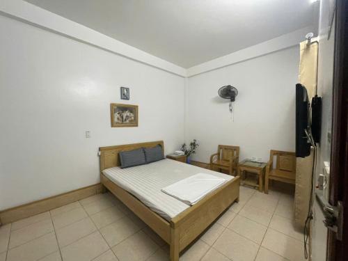 Postel nebo postele na pokoji v ubytování Nhà nghỉ trọ Mai Vân