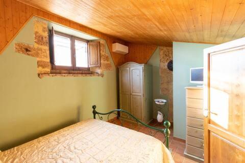 Postel nebo postele na pokoji v ubytování La Corte Segreta & Jacuzzi