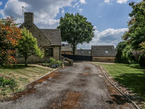 an empty road in front of a house at Bell Garden in Stow on the Wold
