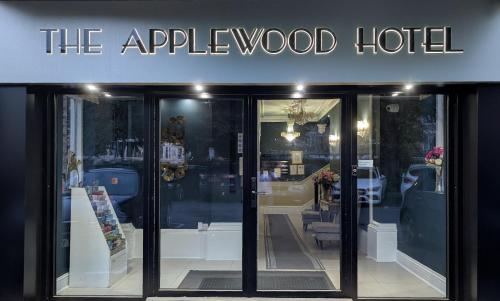 a store front with a sign that reads the apple wood hotel at Applewood Hotel in Bournemouth