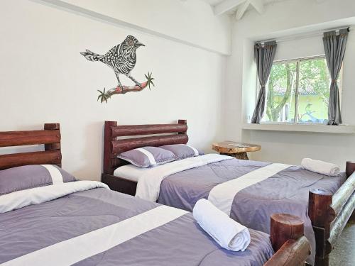 Voodi või voodid majutusasutuse EcoHotel El Castillo Pance toas
