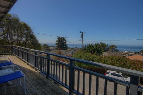 a view of the ocean from the balcony of a house at Snug Harbor in Cambria