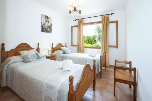 Postel nebo postele na pokoji v ubytování Villa Vidrier I by Villa Plus