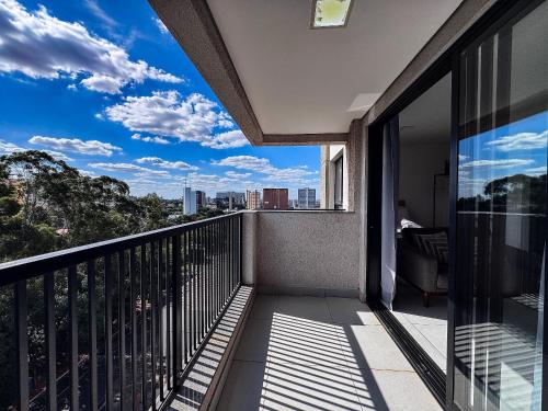 a balcony with a view of the city at Condomínio Residencial Unique Residence - São José do Rio Preto in Sao Jose do Rio Preto