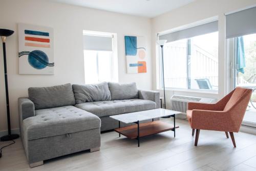 a living room with a couch and a table at Sea Crest in Amagansett