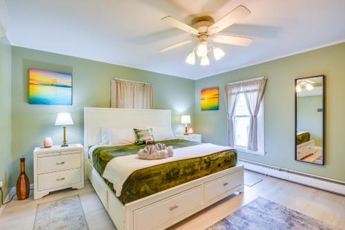 a bedroom with a bed and a ceiling fan at Walk to Downtown - Home with Porch in Clayton! in Clayton