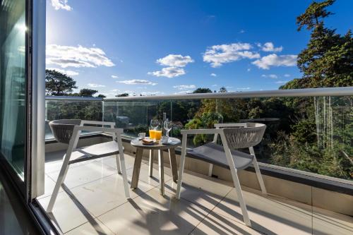 a balcony with a table and chairs on a balcony at Park Hotel in Punta del Este