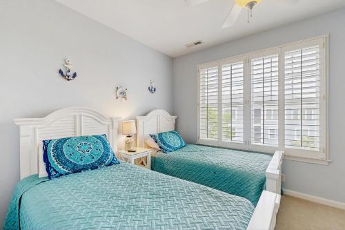 Postel nebo postele na pokoji v ubytování Bayside Resort -31568 Winterberry Pkwy. #305
