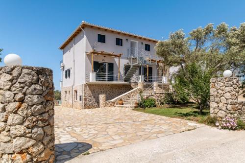 a villa with a view of the house at Apartment with Sea view B in Tsoukaladhes