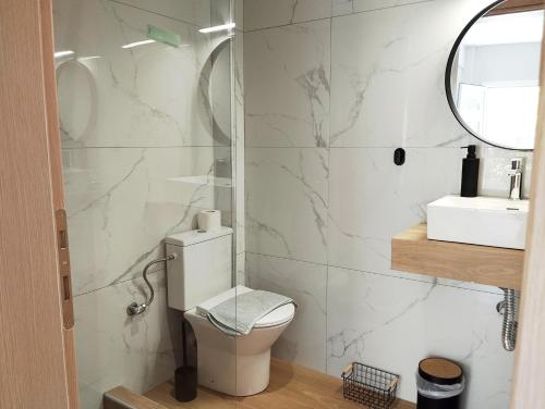 a bathroom with a toilet and a sink at Fani House in Kallithea Halkidikis