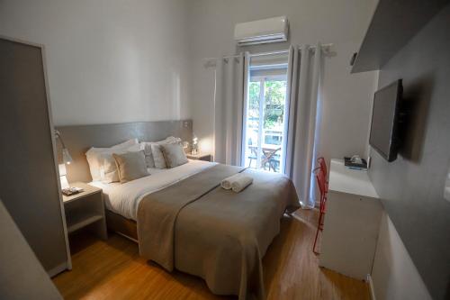 Cama ou camas em um quarto em Injoy Lofts & Studios Ipanema