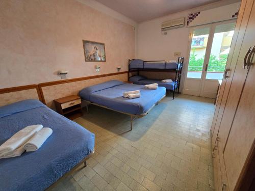 Postel nebo postele na pokoji v ubytování Hotel Rosa