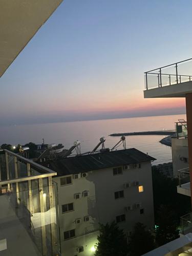 a view of the ocean from the balcony of a building at Shtepipushimi23 Rana e Hedhun in Shëngjin