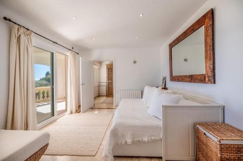 a bedroom with a bed and a large window at Villa Vista Mar in Santa Ponsa
