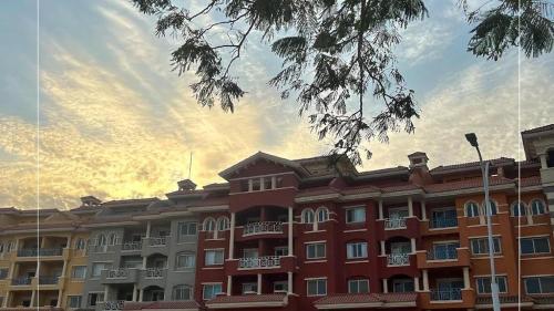 a large red building with a sky in the background at ستوديو بورتو شرم الشيخ in Sharm El Sheikh