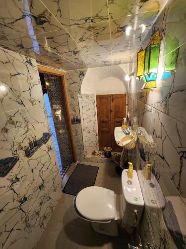 a bathroom with two sinks and two toilets at Riad Bennouna in Fez