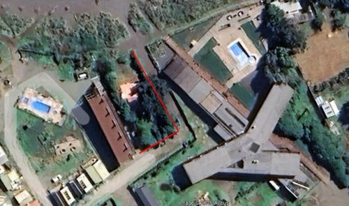 an aerial view of a building with an airplane at SirenaHouse, Casa a metros del Mar in De Cauquenes