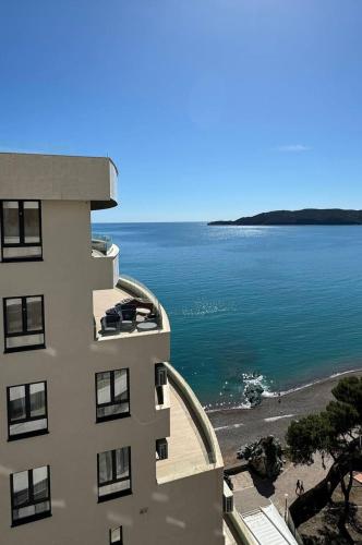a building with a view of the beach and water at Jadran Dream2 in Rafailovici