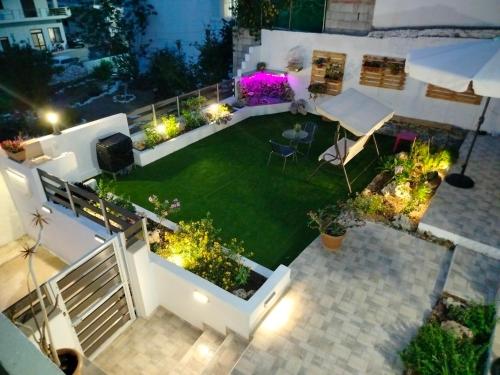 an aerial view of a garden at night with lights at Georgia's garden 2 in Sitia