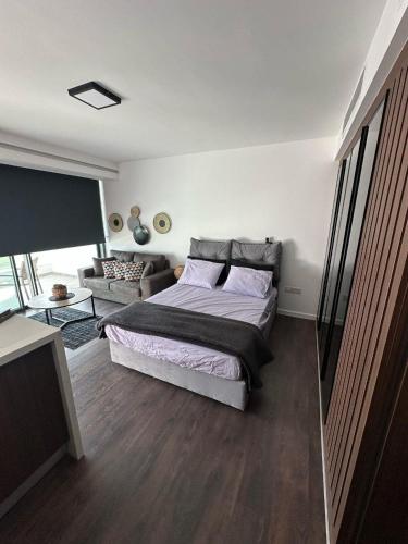 a bedroom with a bed and a living room at Grand Sapphire Resort & Casino in Phikardhou
